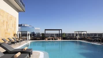 Outdoor pool, open 6:30 AM to 10:00 PM, free pool cabanas