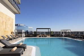 Outdoor pool, open 6:30 AM to 10:00 PM, free cabanas, pool umbrellas
