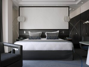 A modern hotel room with a large bed, two bedside tables, a chair, and a small round table. - Sofitel Beirut Le Gabriel (Beirut)