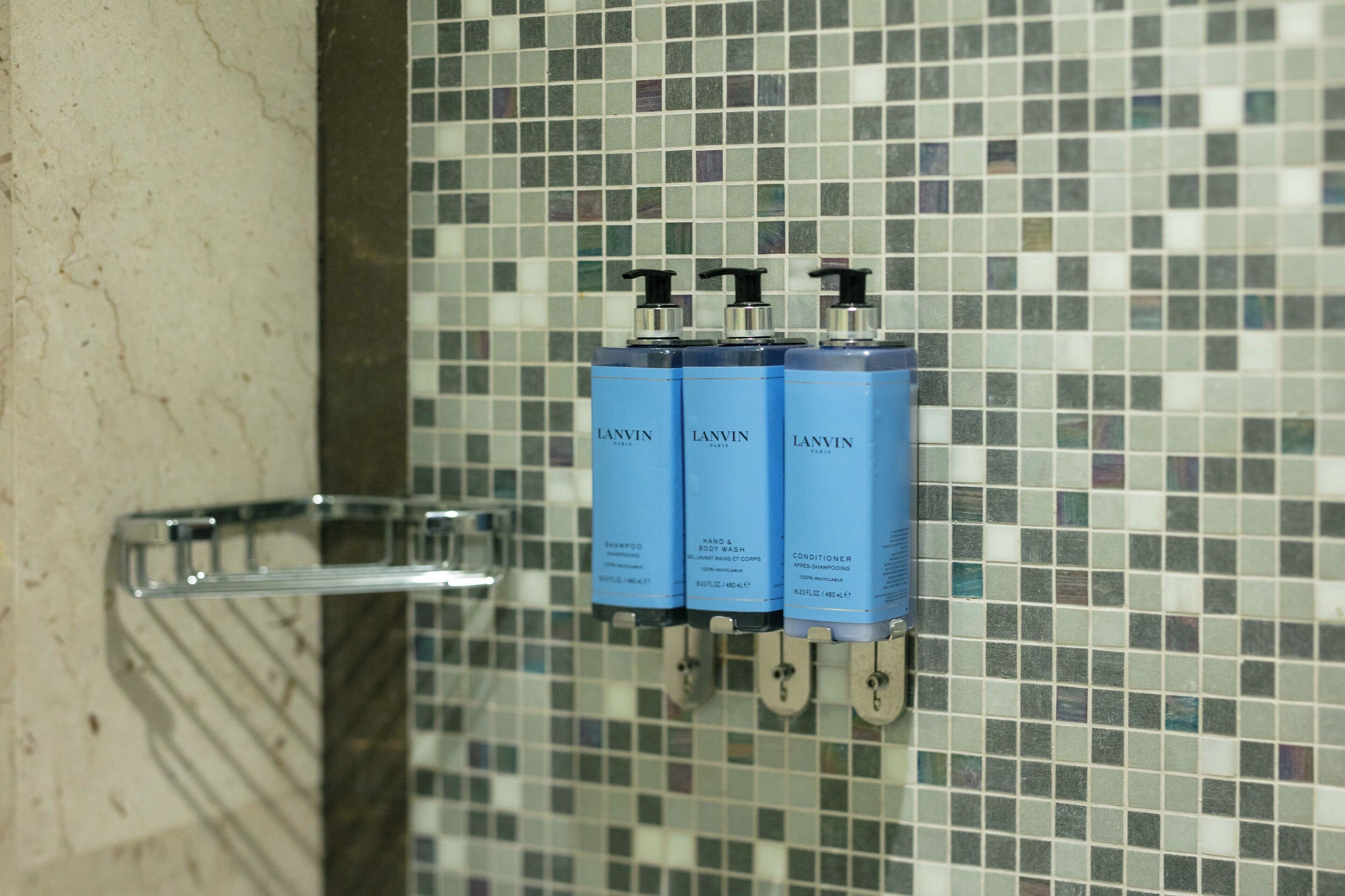 designer toiletries, hair dryer, bathrobes, slippers