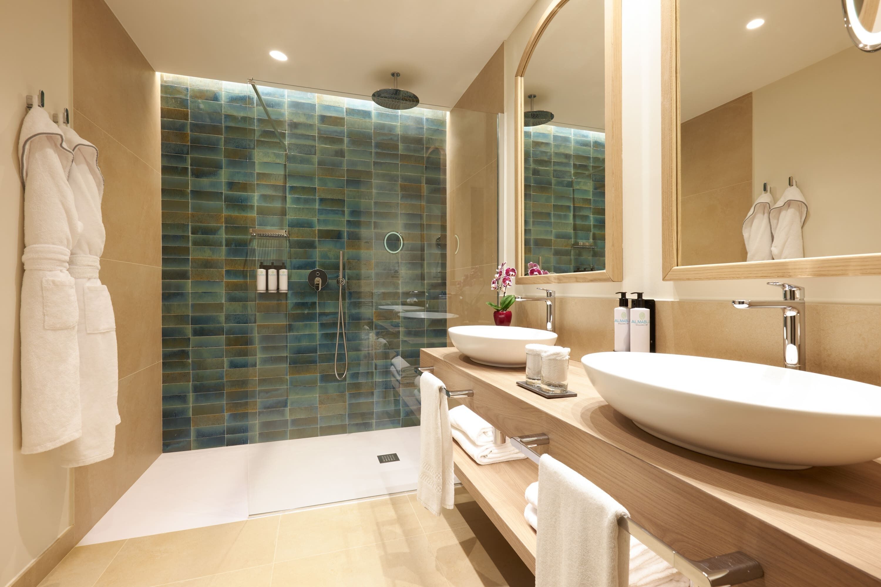 separate bathtub and shower, rainfall showerhead, designer toiletries