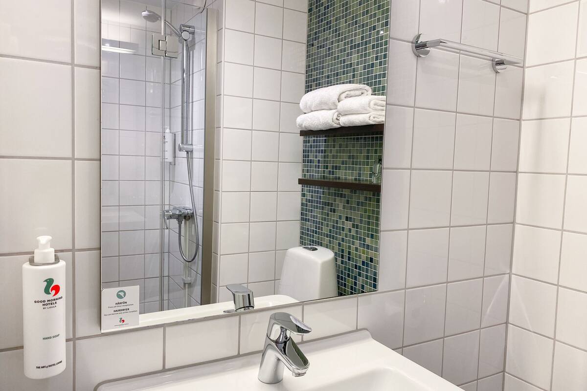 shower, eco-friendly toiletries, towels