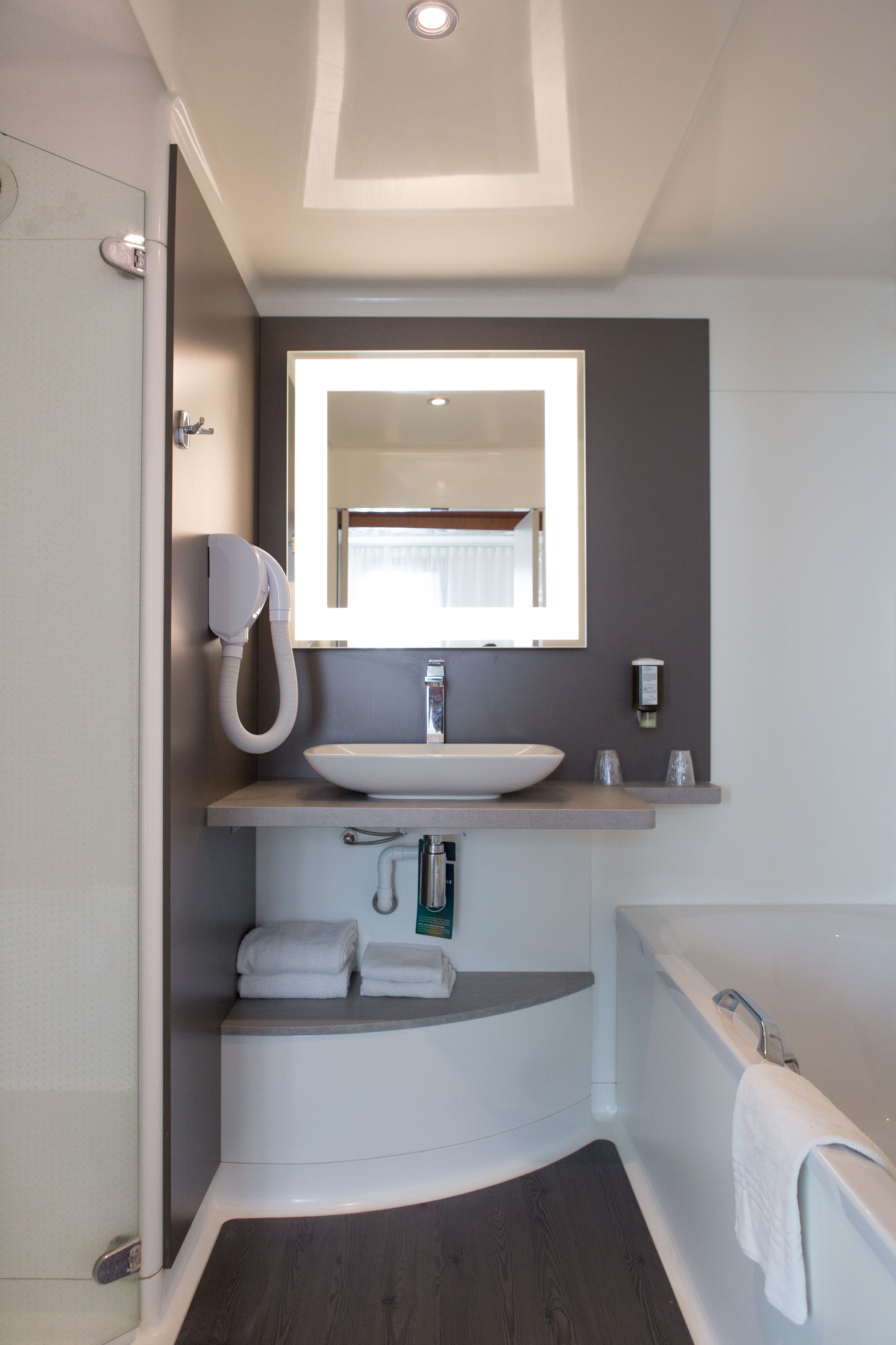 separate bathtub and shower, eco-friendly toiletries, hair dryer, towels