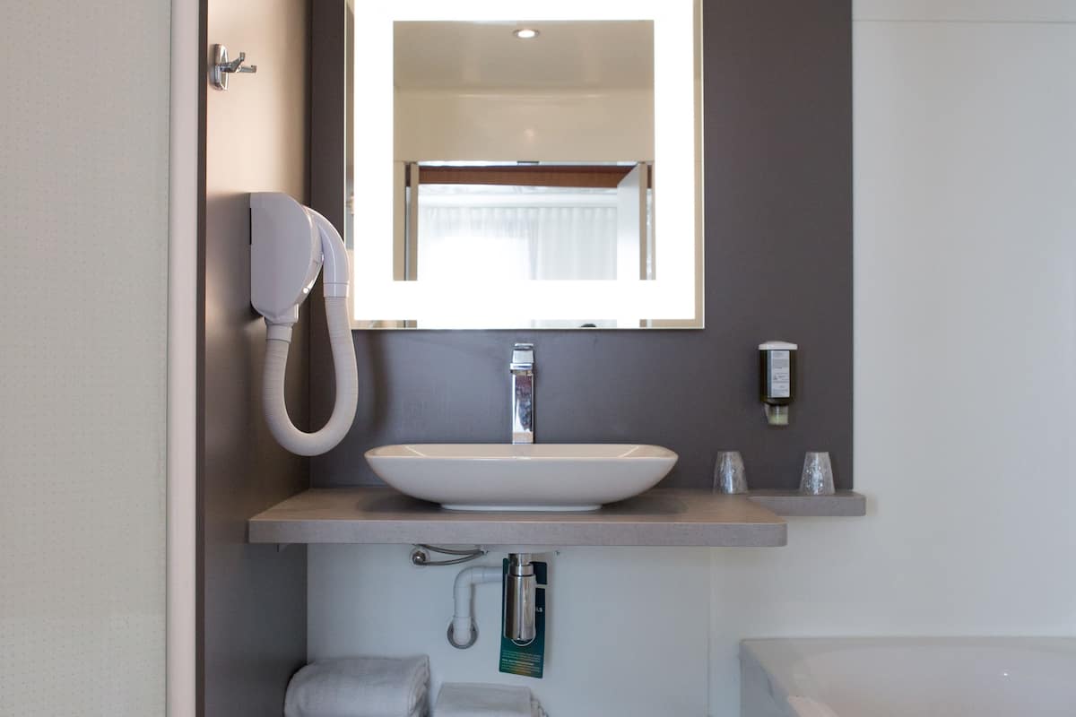 separate bathtub and shower, eco-friendly toiletries, hair dryer, towels