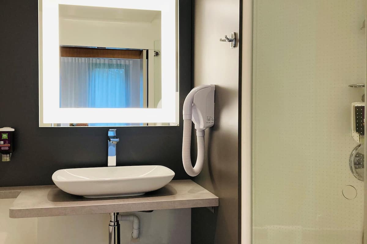 family suite, multiple beds | bathroom | separate bathtub and shower, eco-friendly toiletries, hair dryer, towels