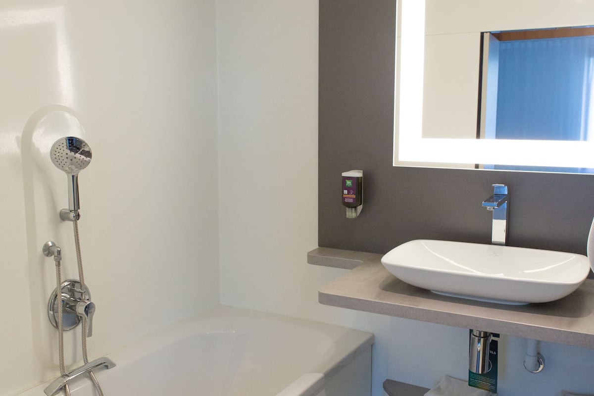 separate bathtub and shower, eco-friendly toiletries, hair dryer, towels