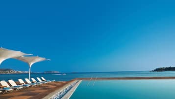 Outdoor pool, pool umbrellas, pool loungers
