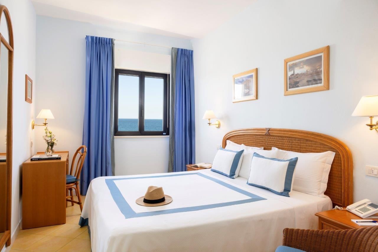 Suite, Sea View | Minibar, in-room safe, desk, blackout curtains