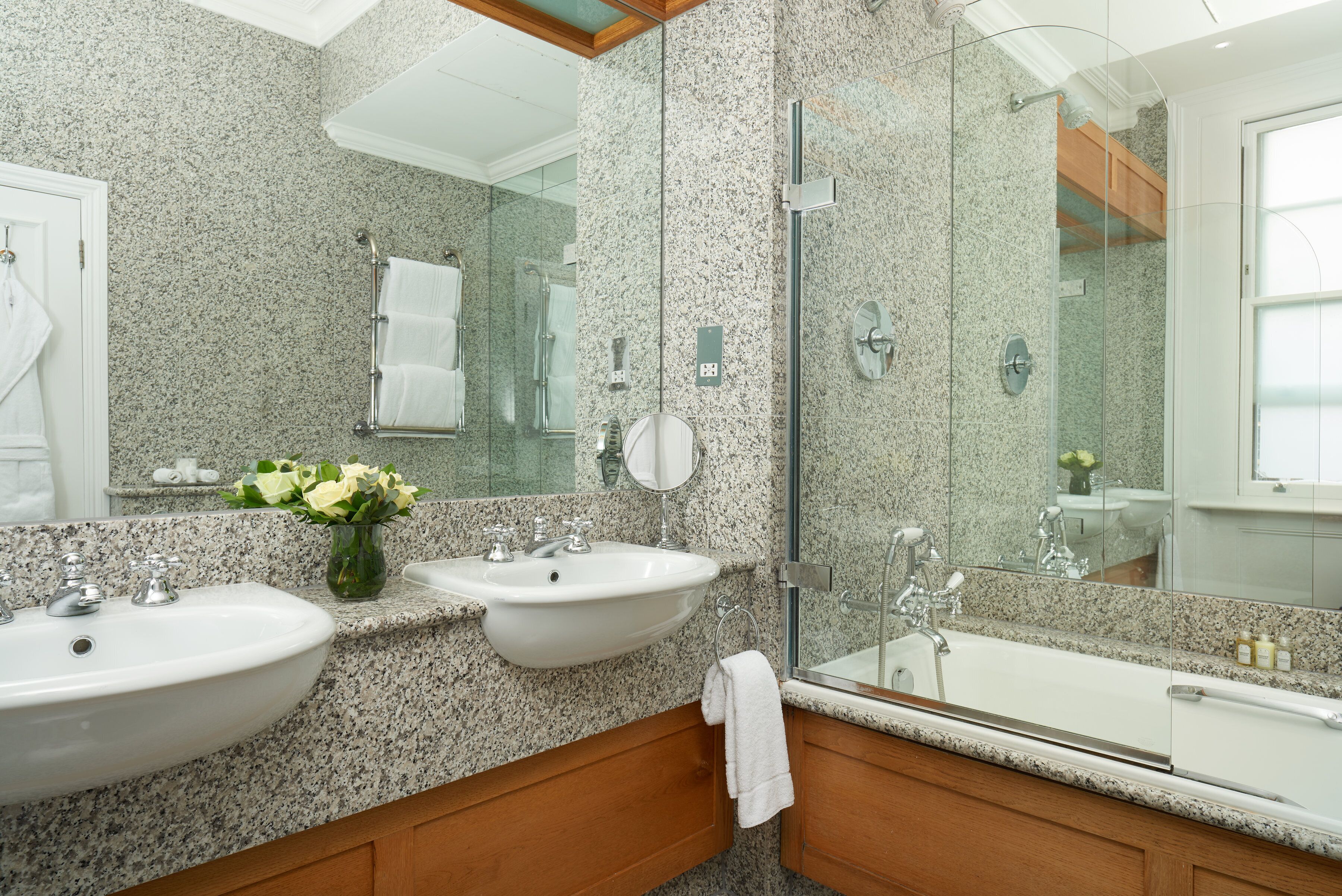 combined shower/bathtub, designer toiletries, hair dryer, bathrobes