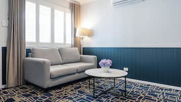 Superior One Bedroom Apartment | Living area | 50-inch TV with cable channels, Netflix, streaming services
