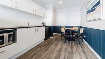Deluxe Two Bedroom Apartment | Private kitchen | Coffee/tea maker, fridge, electric kettle