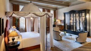 A luxurious bedroom with a canopy bed, a large mirror, and a classic wardrobe. - J And J Historic House Hotel (Florence)