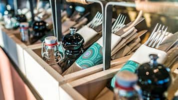 A neatly organized bar area with various bottles and utensils.