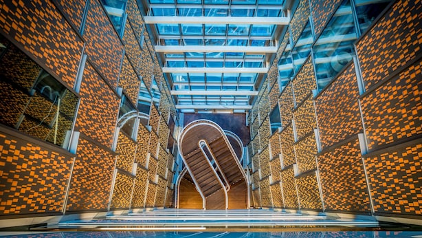 A modern building with a glass ceiling and patterned walls. - Scandic Continental (Stockholm)