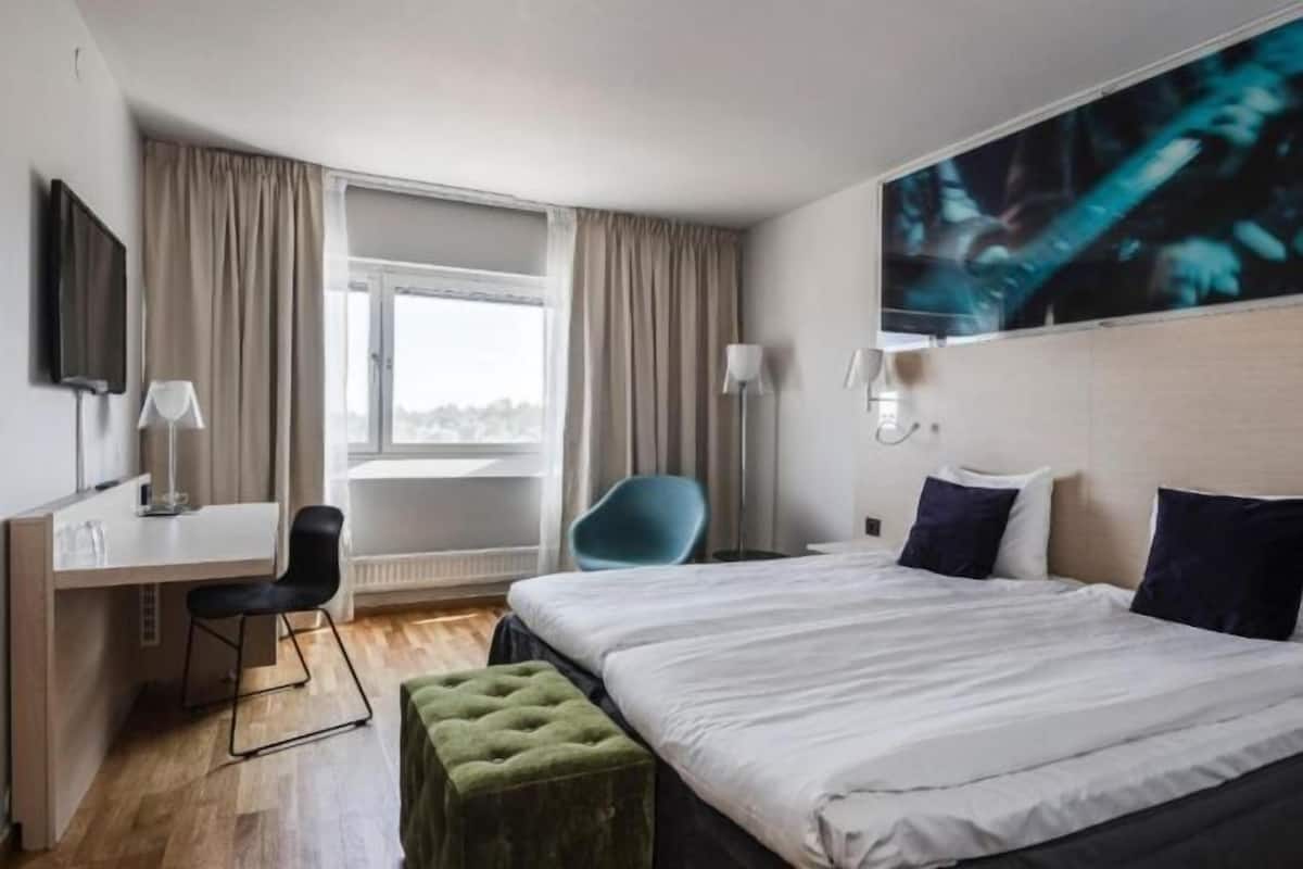Desk, iron/ironing board, bed sheets