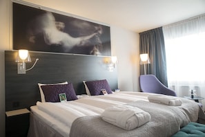 Desk, iron/ironing board, bed sheets