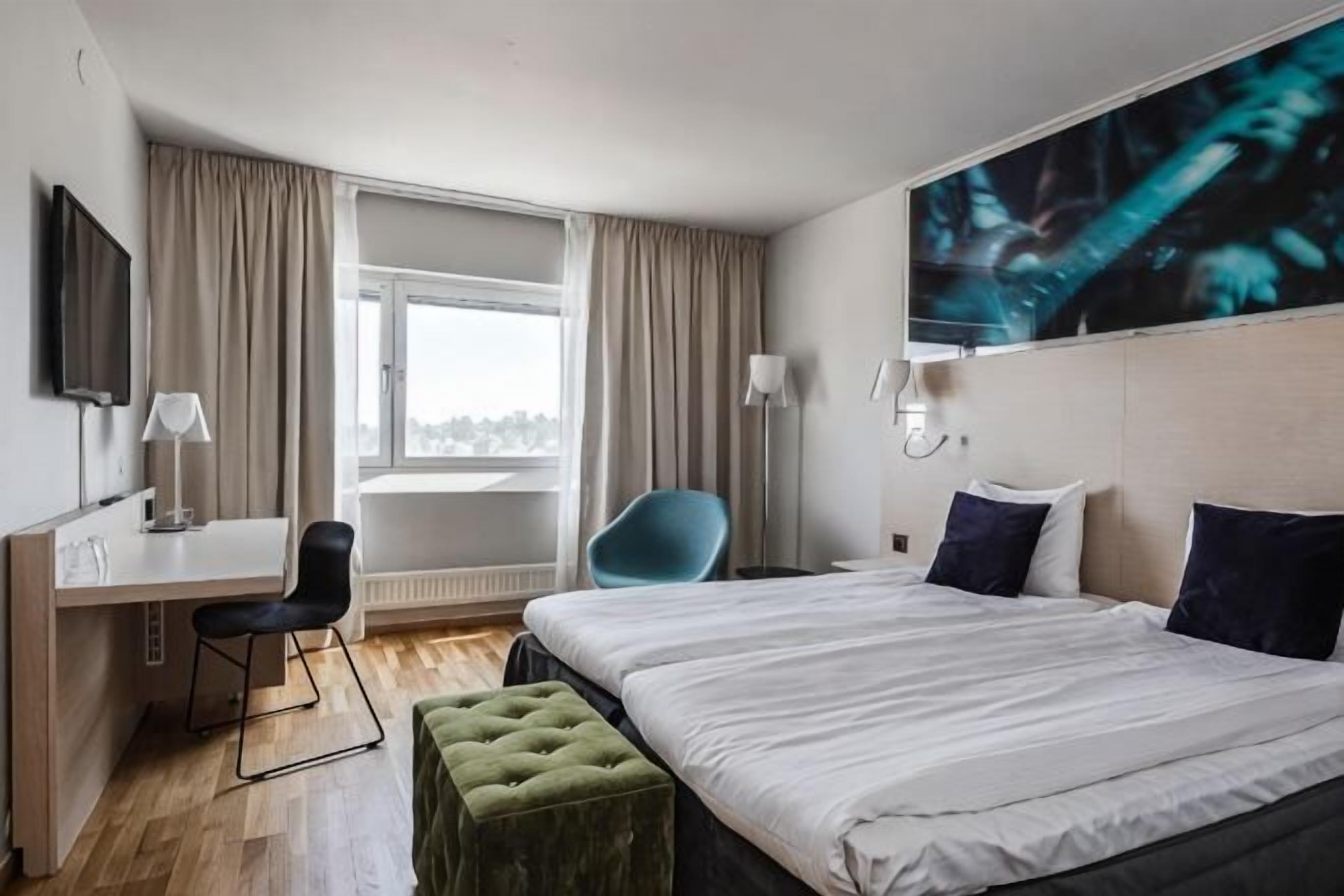 Desk, iron/ironing board, bed sheets