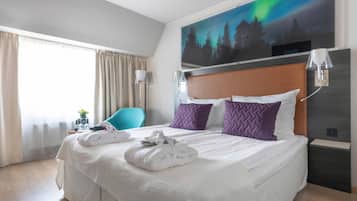 Desk, iron/ironing board, bed sheets