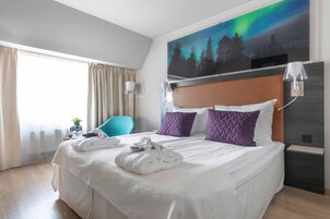 Desk, iron/ironing board, bed sheets