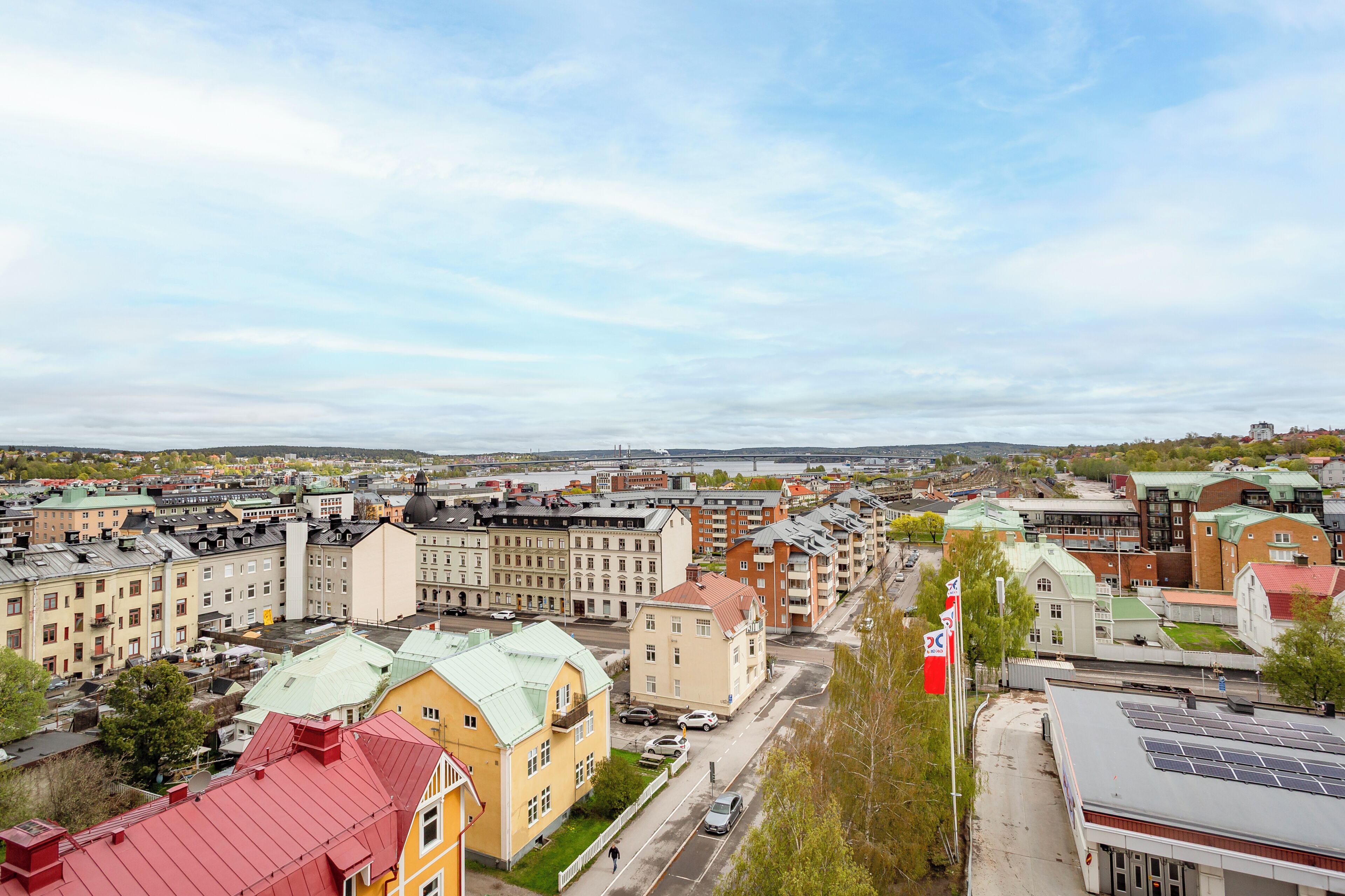 A cityscape with buildings, roads, and a flag.