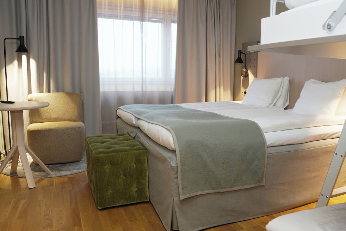 Family Room | Desk, iron/ironing board, bed sheets