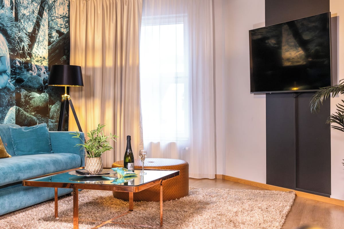 desk, iron/ironing board, bed sheets