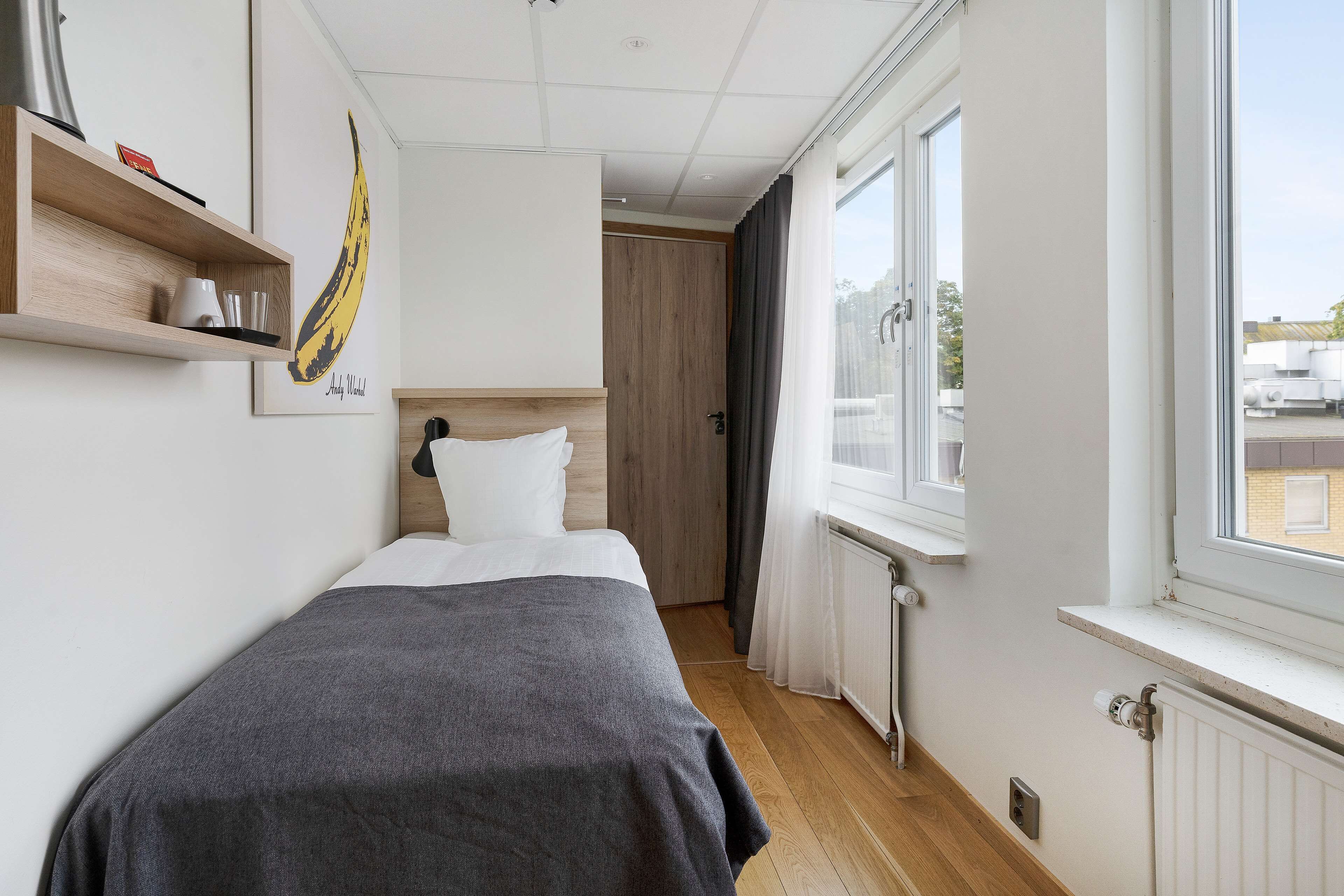 economy room, 1 single bed, non smoking (small room) | blackout curtains, iron/ironing board, free wifi, bed sheets