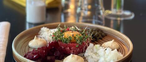 A plate of food with various toppings and garnishes.