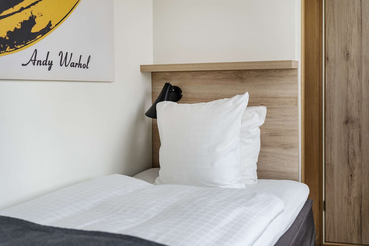 Economy Room, 1 Single Bed, Non Smoking (Small Room) | Blackout curtains, iron/ironing board, free WiFi, bed sheets