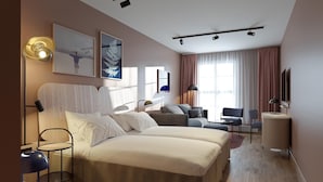 A modern hotel room with a large bed, a desk, a chair, a sofa, and a TV. - Scandic Grand Marina (Helsinki)
