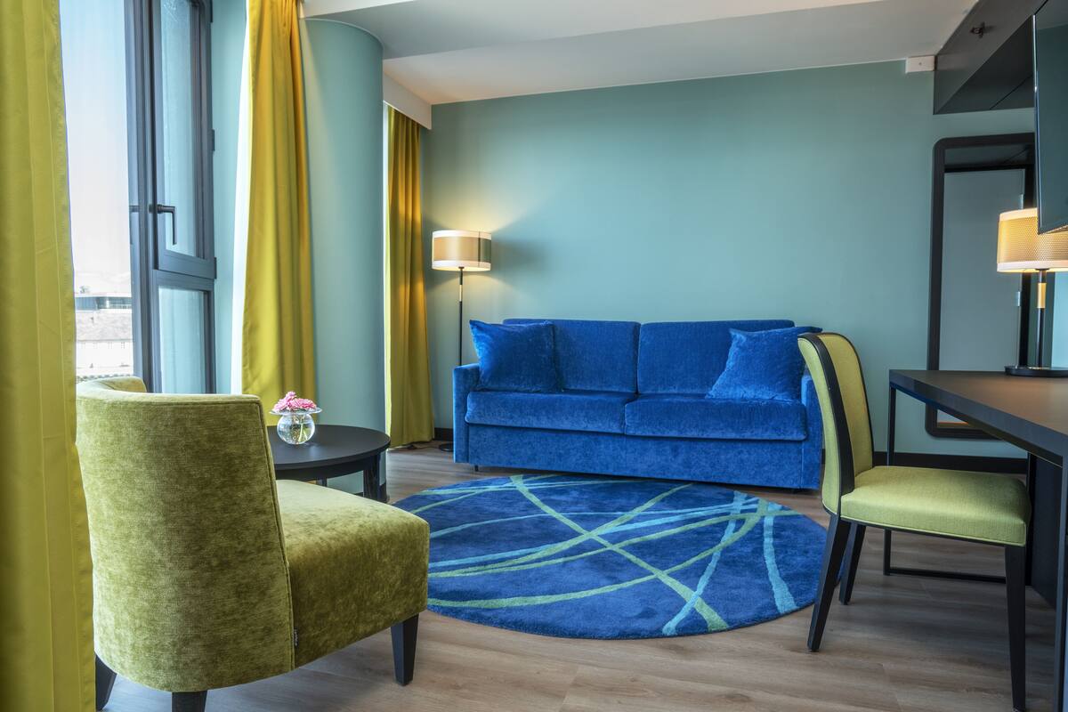 suite, non smoking | living area | 50-inch flat-screen tv with digital channels, tv