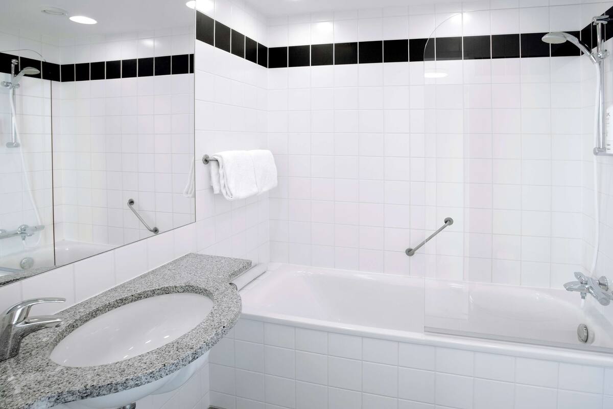 junior suite | bathroom | eco-friendly toiletries, hair dryer, towels, soap