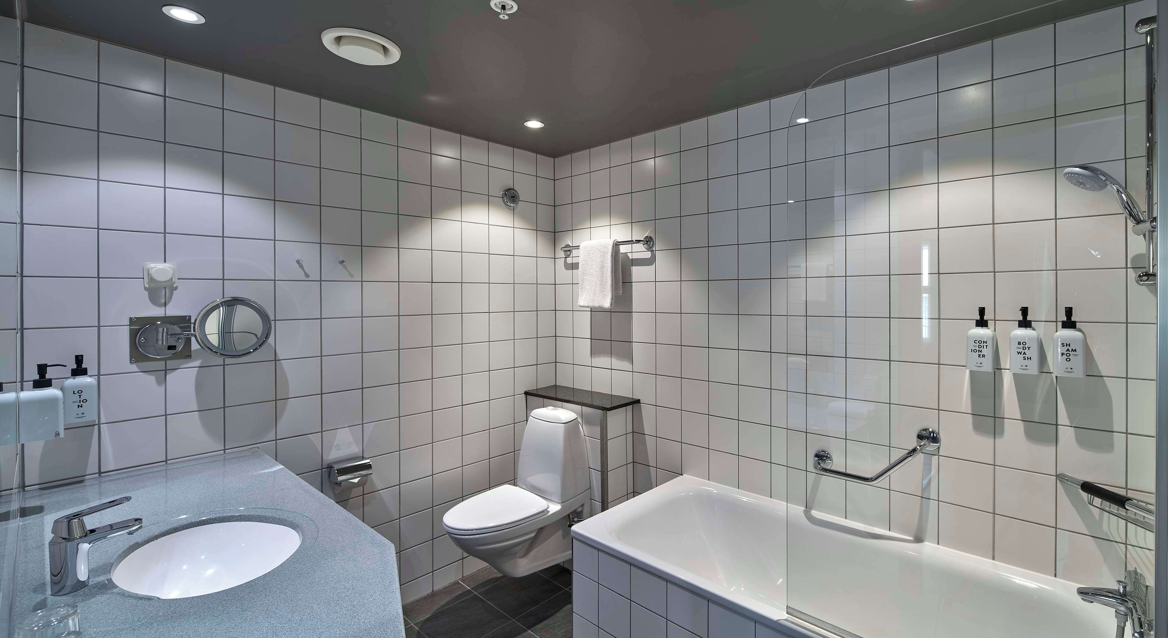 superior twin room | bathroom | combined shower/bathtub, hair dryer, towels
