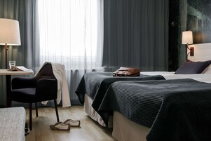 Twin Room | Desk, laptop workspace, blackout drapes, iron/ironing board