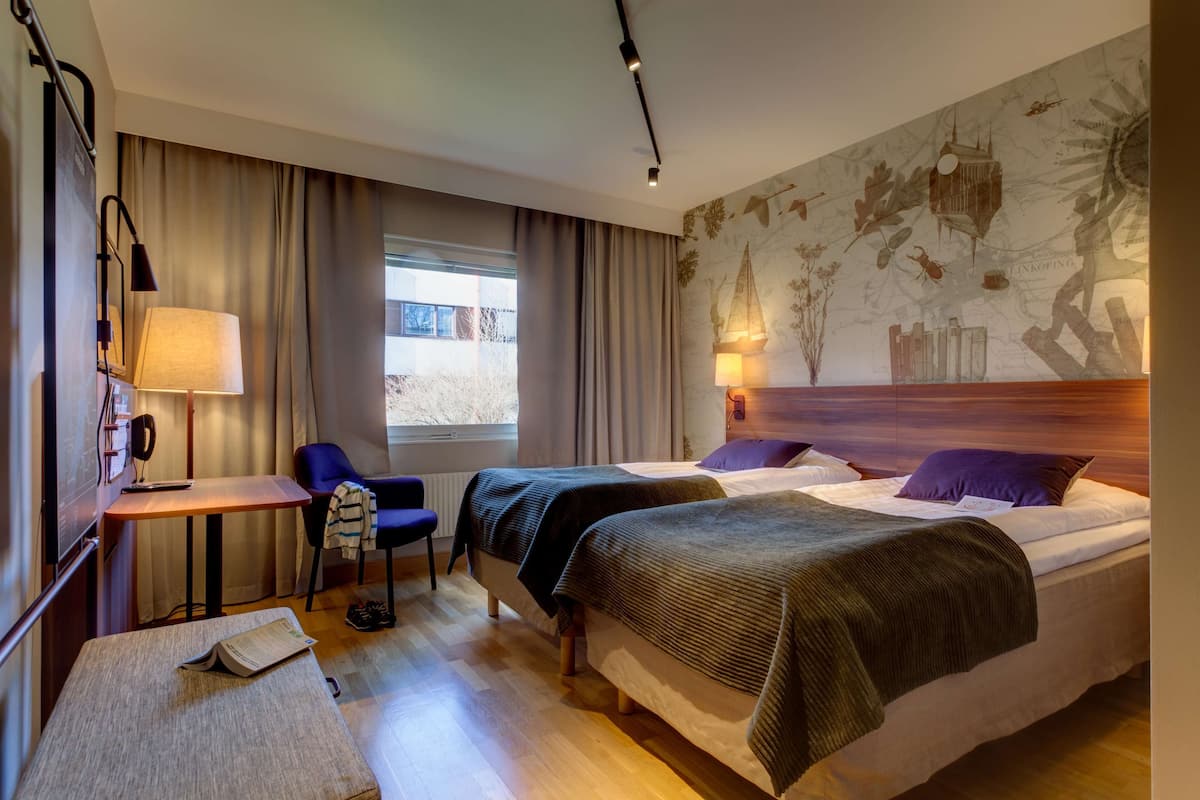 Twin Room | 1 bedroom, desk, blackout drapes, iron/ironing board