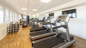 A gym with treadmills, dumbbells, and exercise equipment. - Scandic Hallandia (Halmstad)