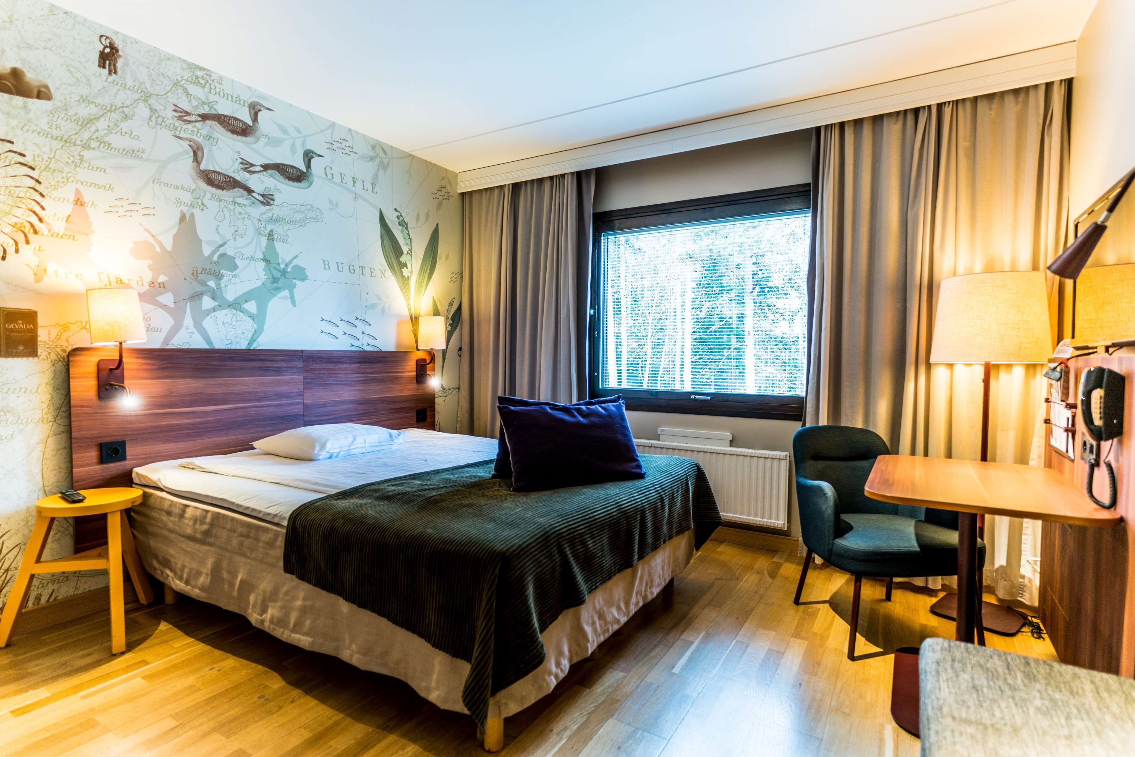 family room | desk, blackout curtains, iron/ironing board, free cots/infant beds