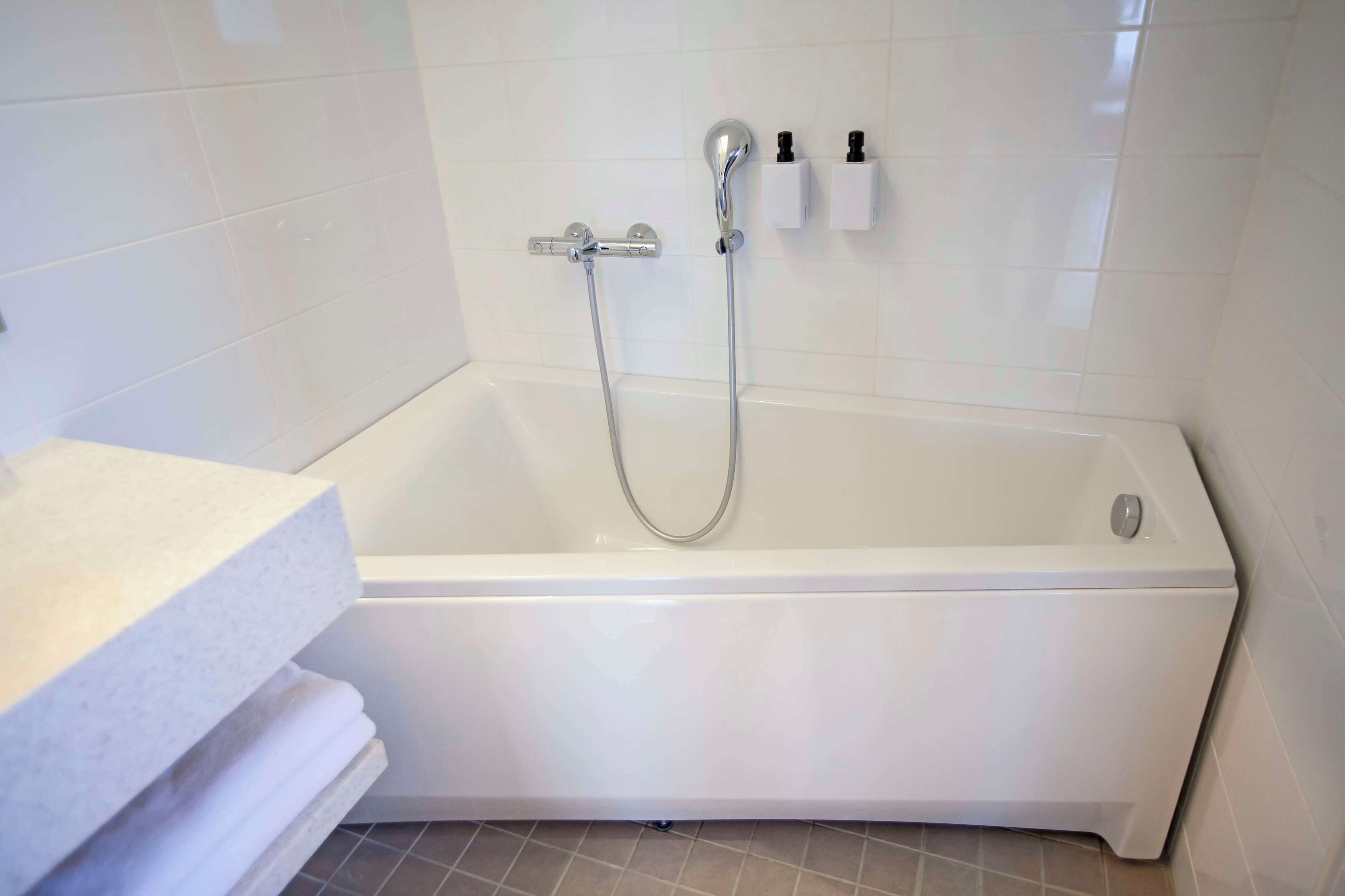 junior suite | bathroom | shower, free toiletries, hair dryer, bidet
