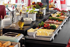 A buffet with various food items including cheese, fruits, and vegetables. - Best Western Hotel 23 (Loddekopinge)
