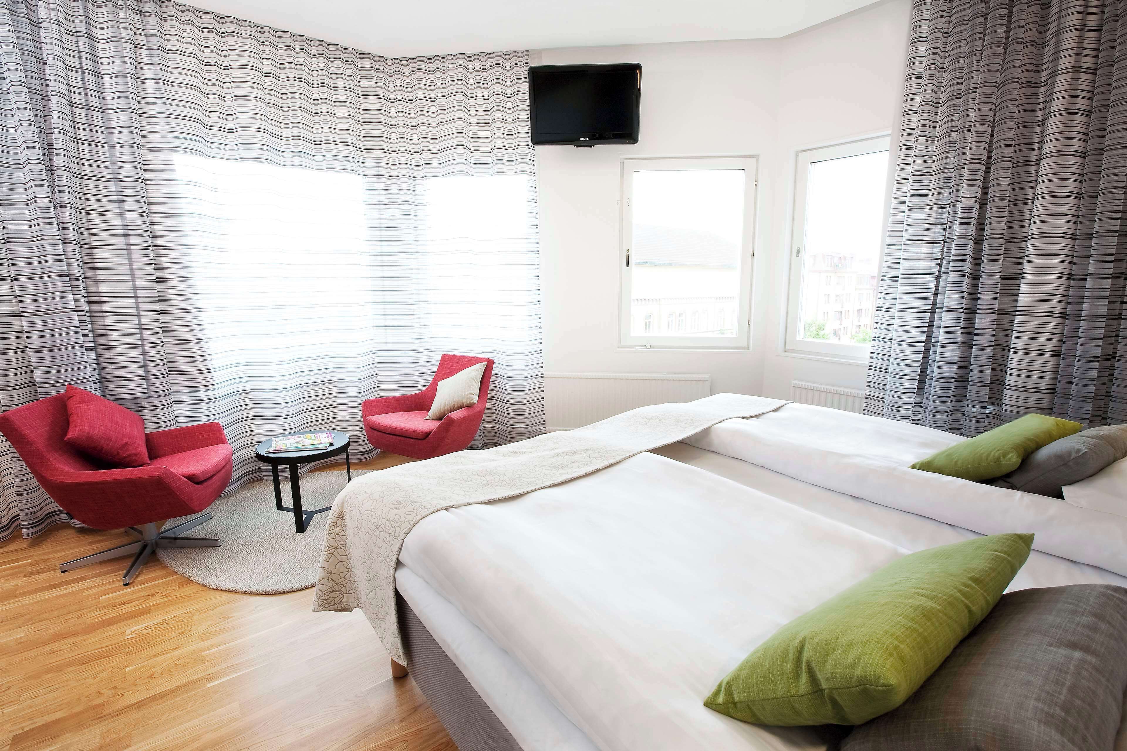 superior room, 1 king bed | in-room safe, desk, iron/ironing board, free cots/infant beds