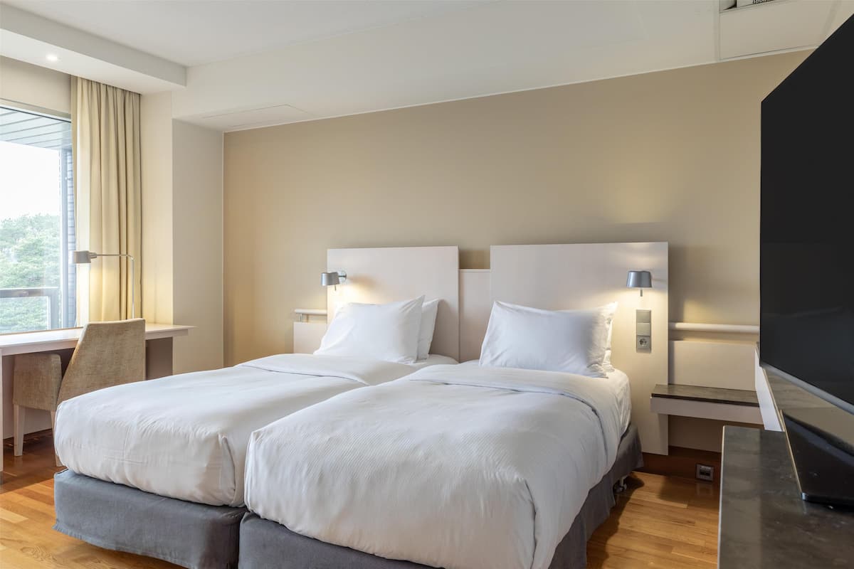 Room, 2 Twin Beds, Balcony, Partial Sea View | Hypo-allergenic bedding, minibar, in-room safe, desk