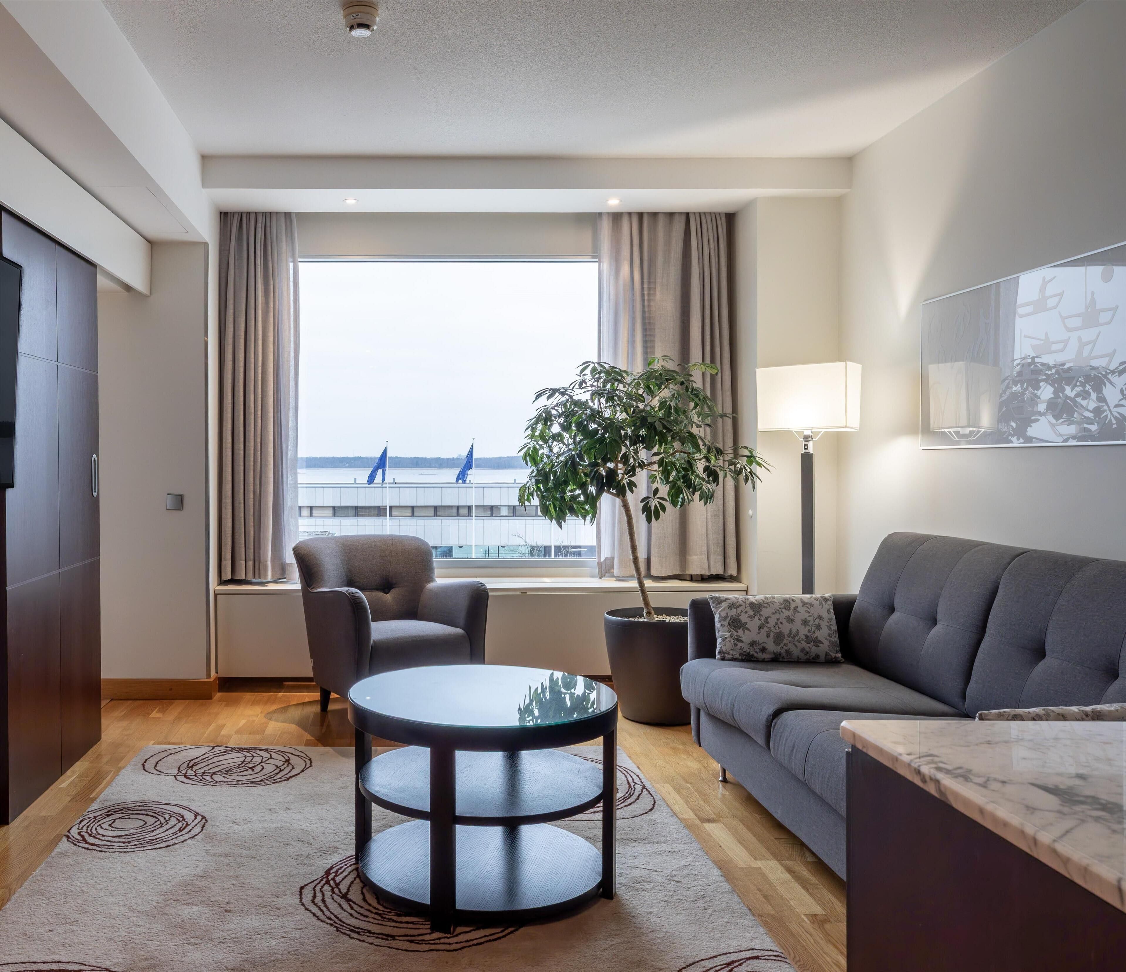 junior suite, 1 king bed | living area | tv