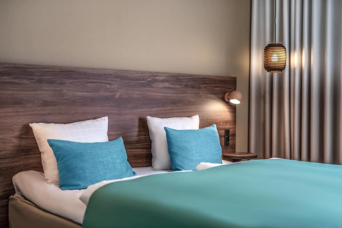 double room (compact) | in-room safe, blackout curtains, iron/ironing board, cots/infant beds