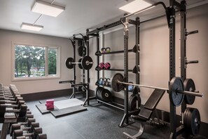 Stay fit and active with our well-equipped gym featuring a variety of weightlifting equipment.
