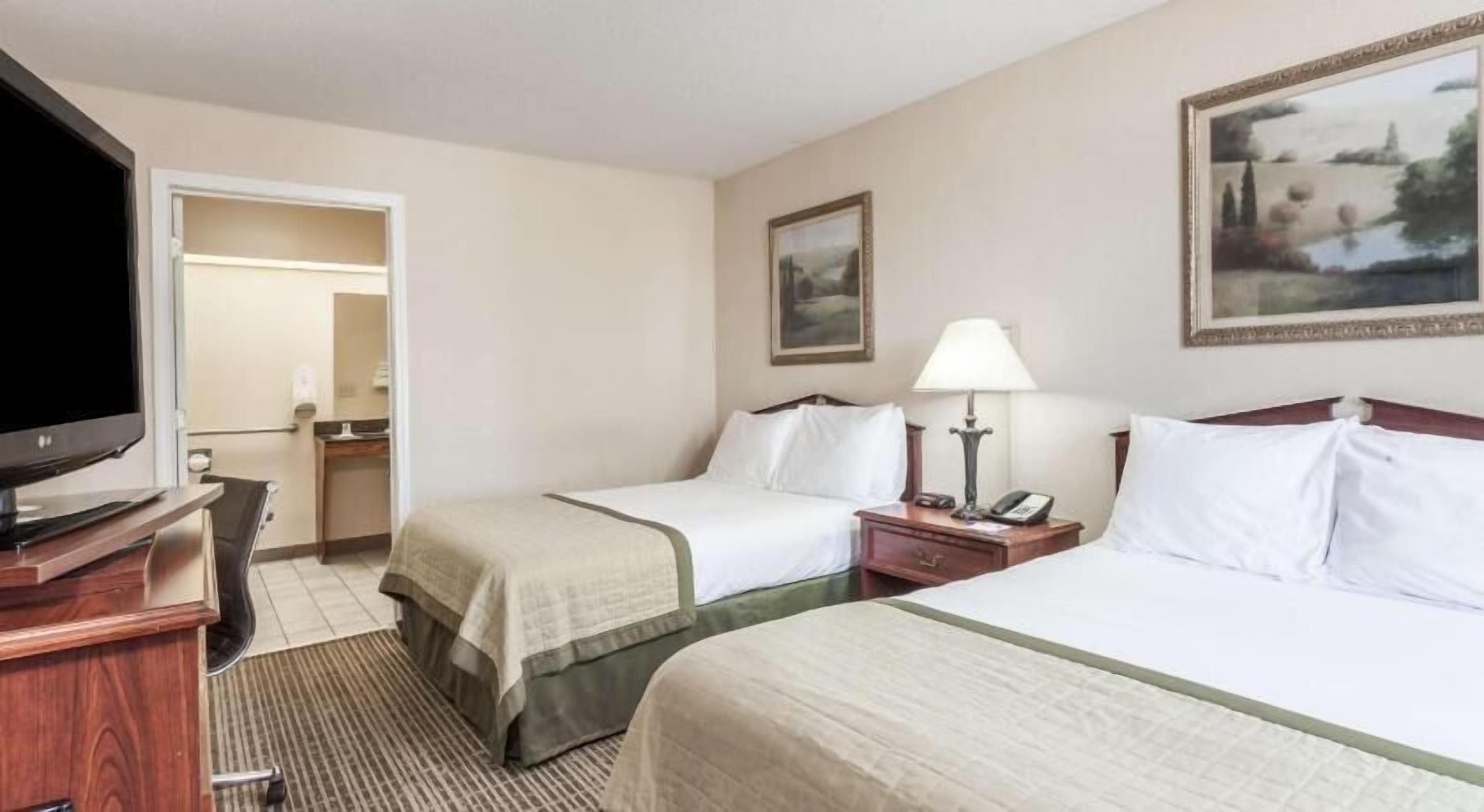Pillow-top beds, desk, blackout curtains, iron/ironing board