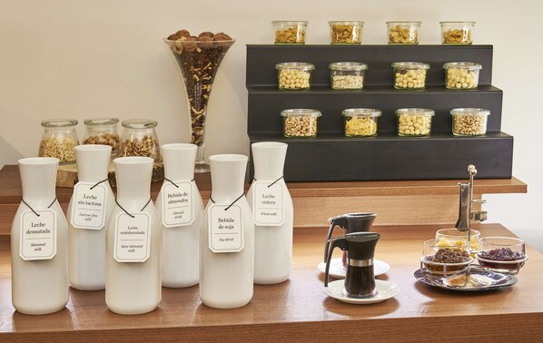 A display of milk products and grains on a wooden counter.