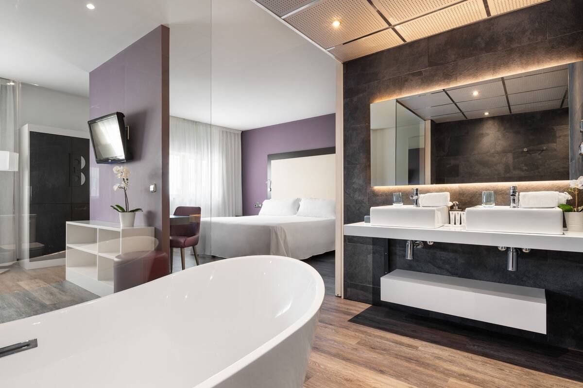 superior room | bathroom | bathtub, eco-friendly toiletries, hair dryer, bidet