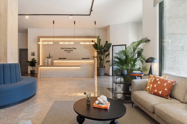 Relax in style with a comfortable sofa and a cozy reading nook.