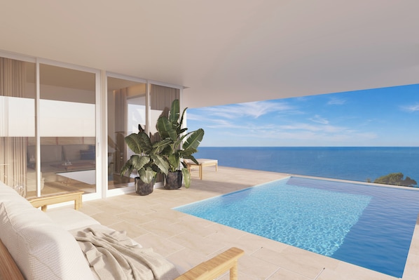 A modern infinity pool with a clear view of the ocean, a comfortable seating area with a sofa and a bench, and large potted plants.