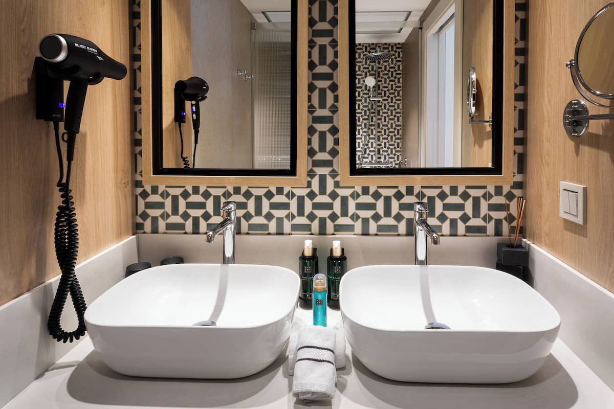 Shower, rainfall showerhead, designer toiletries, hair dryer